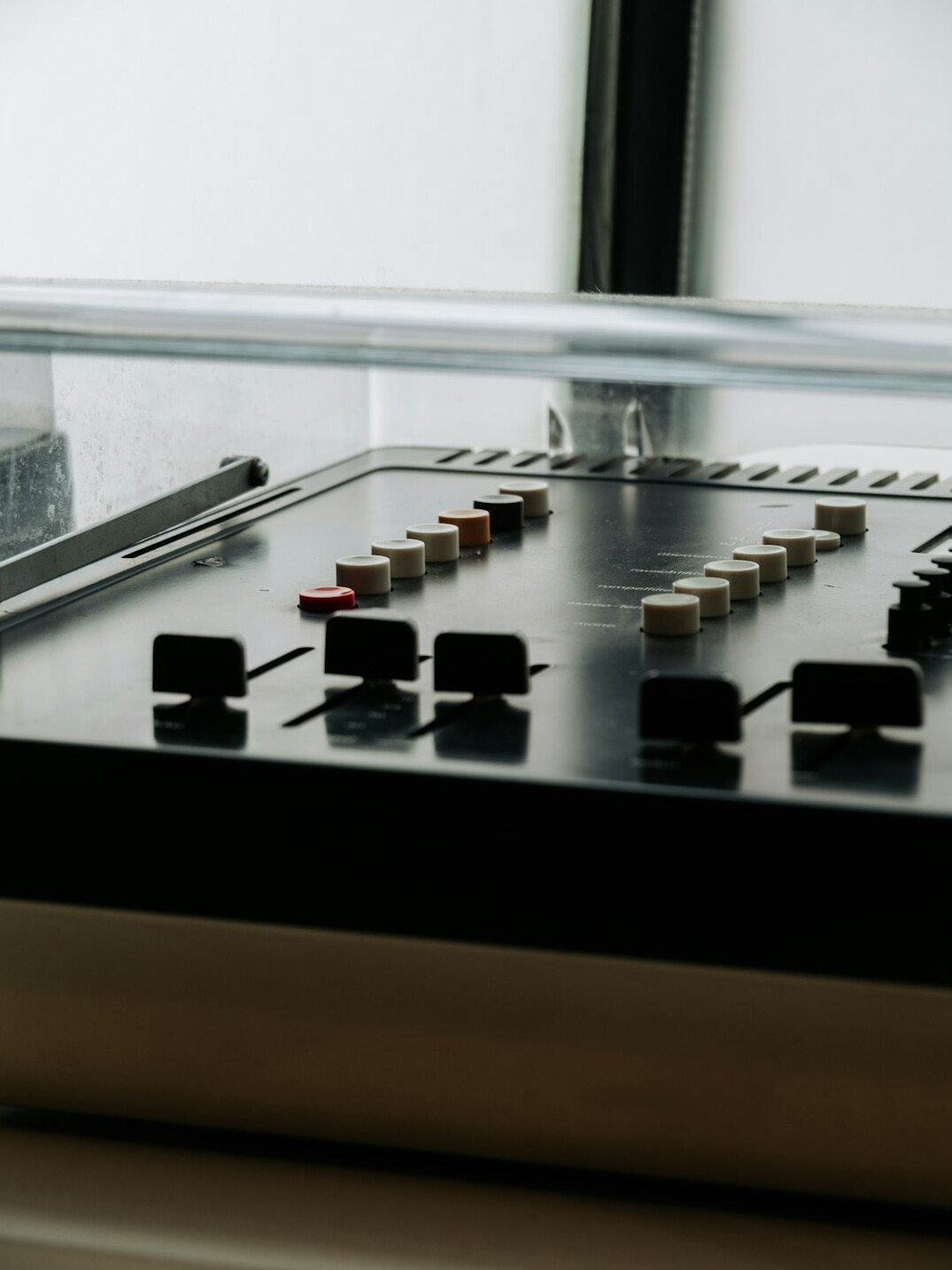 Wide view of a television control room with technical director at the desk